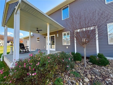 Rear porch with beautiful landscaping