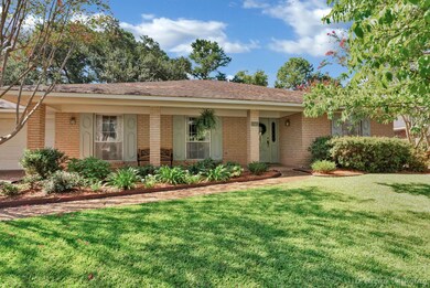 Ranch-style home featuring a front yard