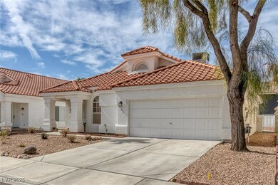 Mediterranean / spanish house with a garage, concr