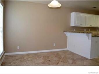 The breakfast room is open to the kitchen and grea