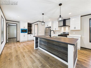 Bright and open, this kitchen offers plenty of storage and prep space, seamlessly connected to the main living area
