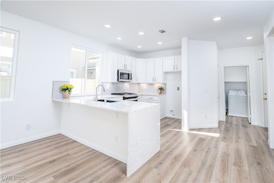 Kitchen with appliances with stainless steel finis