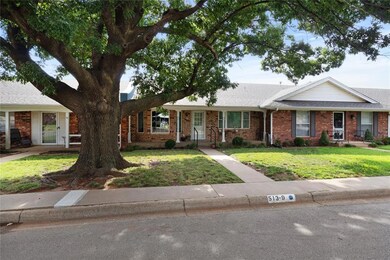 Ranch-style home featuring a front lawn