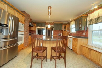 Kitchen with granite center island. Built in oven 