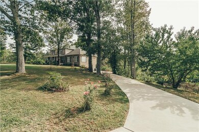 You will love the private, wooded drive to enter the property. Enjoy lots of parking space including the 2 Car Basement Garage.