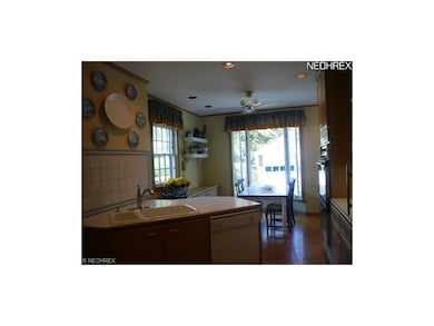 Kitchen opens onto large open space for dining.
