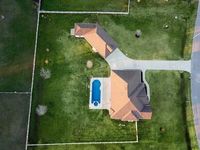 An aerial view of the property shows the 1.2 acre