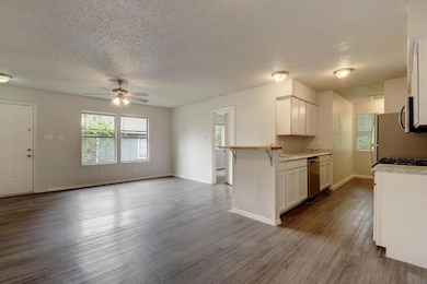Kitchen featuring a ceiling fan, stainless steel 