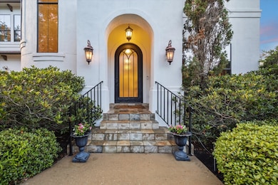 Mature landscaping in the front with lovely archit