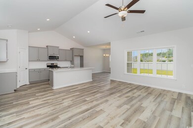 Kitchen with gray cabinets, a center island with s