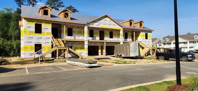 View of front of property featuring stairs, a porc