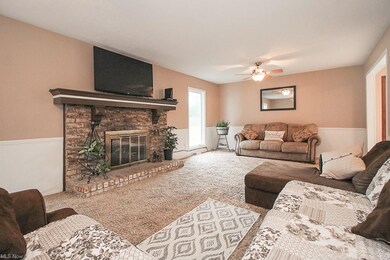 The family room boasts a lovely woodburning firepl