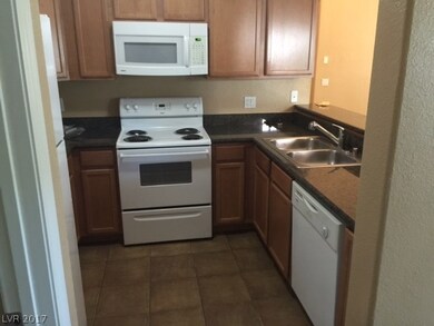 Kitchen has breakfast bar with granite counter top