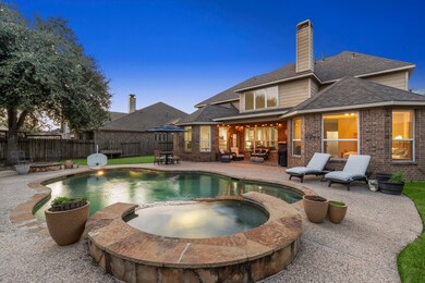This inviting backyard features a spacious patio a