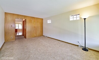 Hardwood floors under neutral carpeting