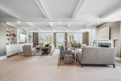 Expansive family room with fireplace open to the k