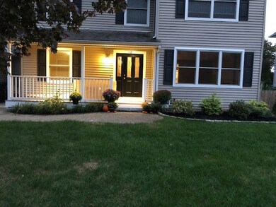 Twilight view of front exterior and porch