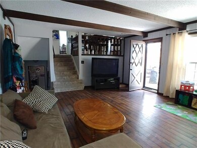 Family room off of kitchen that walks out to a nic