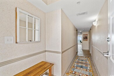 Corridor with visible vents and tile patterned flo