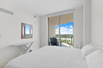 Bedroom with access to outside, expansive windows,