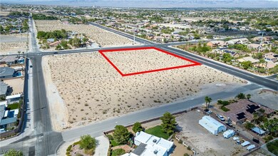 Aerial view of residential area with property boundaries highlighted and mountains