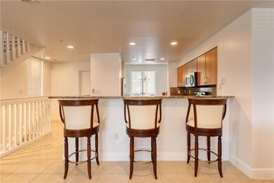 Breakfast bar with high countertops into open and