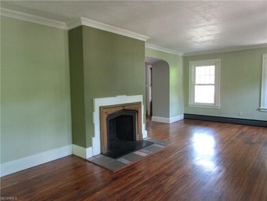 Enter into the living room with hardwood floors an