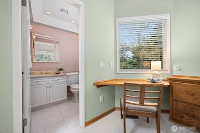 There is a powder room adjacent to the personal desk area that looks toward the bay views.