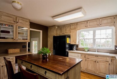 The Spacious Kitchen has a custom island and views