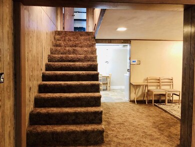 Stairway is in the dinning room just past the kitc