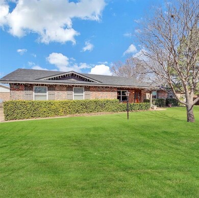 Single story home with a front yard and brick exte