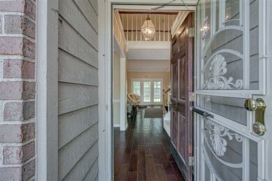 Nicely landscaped front yard leads you to the entr
