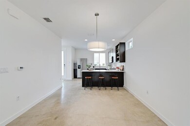 Kitchen featuring a kitchen breakfast bar, light 