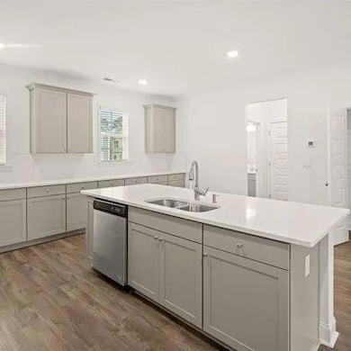 Kitchen featuring stainless steel dishwasher, gray