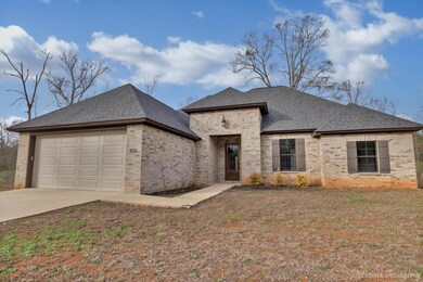View of front of home featuring a front yard and a