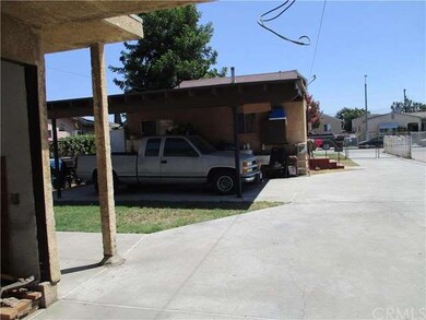 Front House car port, laundry area, back view of f