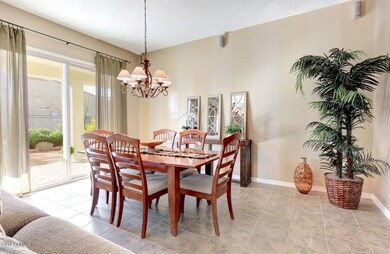 Comfortably Formal Dining Rm looks out t