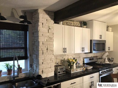 Stone work in kitchen adds so much character!