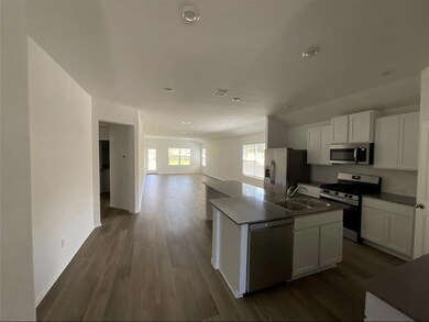 Kitchen featuring stainless steel appliances, ope
