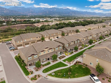 Aerial perspective of suburban area with a mountain backdrop