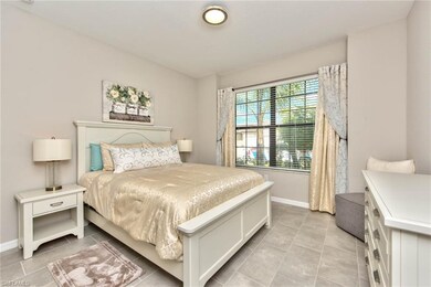 Guest bedroom 1 with tile floor & upgraded light f