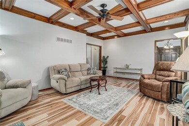 Beautiful wood flooring and coffered ceiling with 