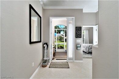 Hallway looking back out into entry way. Guest bedroom to the right