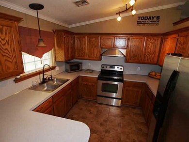 Kitchen. Country Kitchen opens up to dining area