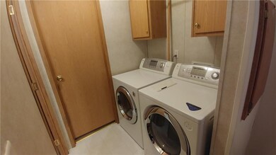 laundry area. washer and dryer included
