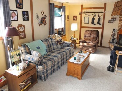 Family room has brick fireplace.