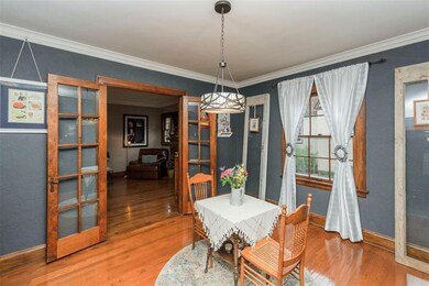 Beautiful french doors lead from the living room t