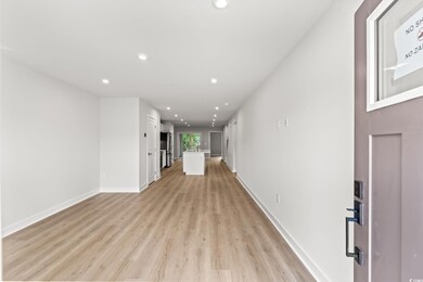Unfurnished living room featuring recessed lighting and light wood-type flooring