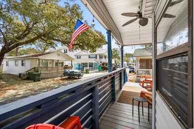 Wooden terrace with a porch and ceiling fan