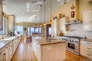 Gourmet kitchen is a chef's dream with granite cou